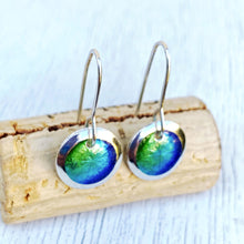 Load image into Gallery viewer, Mixed blues and greens fine silver starburst enamel earrings, 1/2" round with silver rims