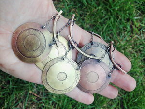 handful of handmade gong necklaces