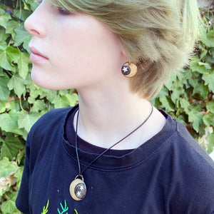 model wearing moon  and start enamel pendant and earrings set seaside harmony jewelry