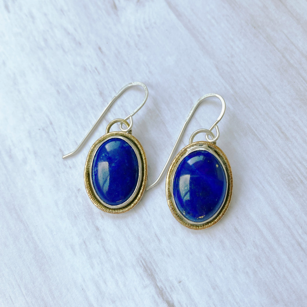 Lapis lazuli gold rimmed oval earrings