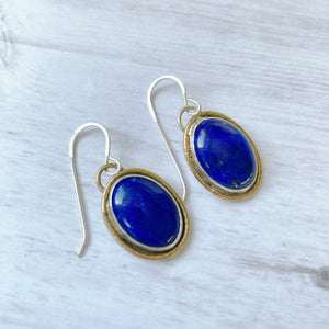 Lapis lazuli gold rimmed oval earrings