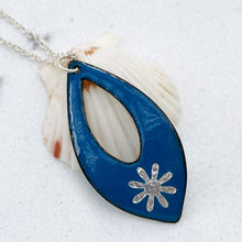 Load image into Gallery viewer, blue enamel silver snowflake necklace with silver chain on shell